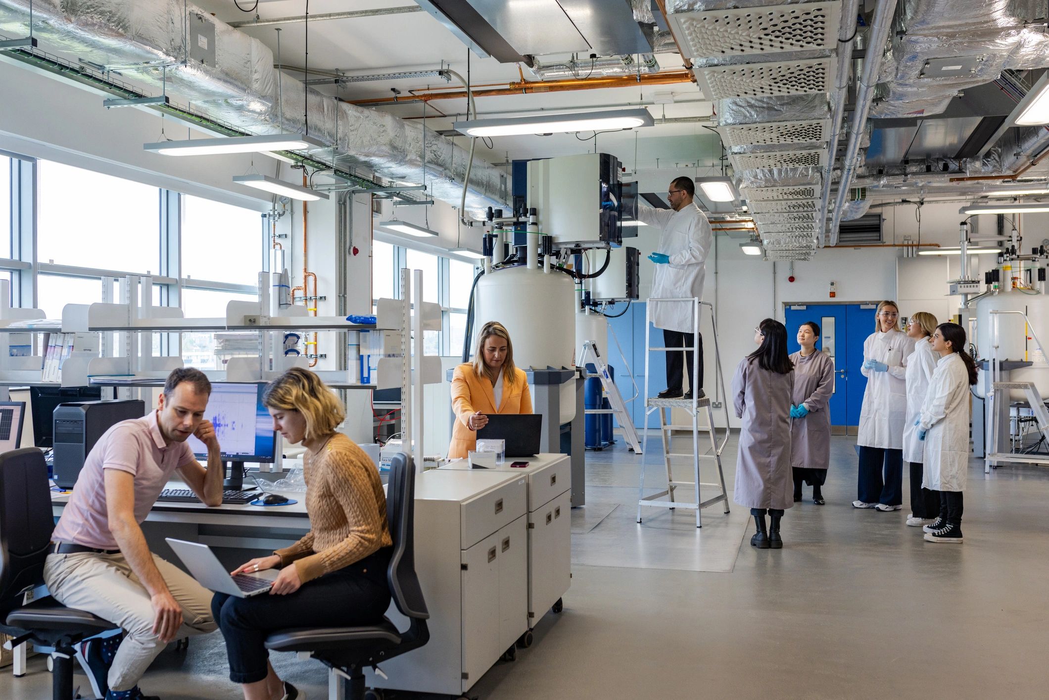 Scientific team reviewing research data in a lab